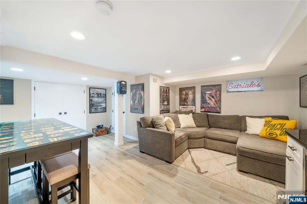 25 Glenview Road Nutley, NJ 07110 - Photo 40 of 49 a living room with furniture and a wooden floor