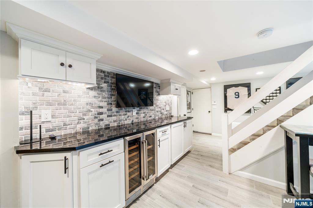 25 Glenview Road Nutley, NJ 07110 - Photo 41 of 49 a kitchen with stainless steel appliances kitchen island granite countertop a sink and a microwave