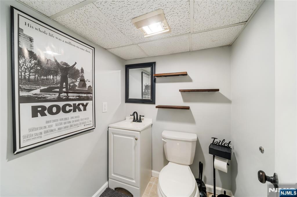 25 Glenview Road Nutley, NJ 07110 - Photo 42 of 49 a white toilet sitting next to a bathroom sink