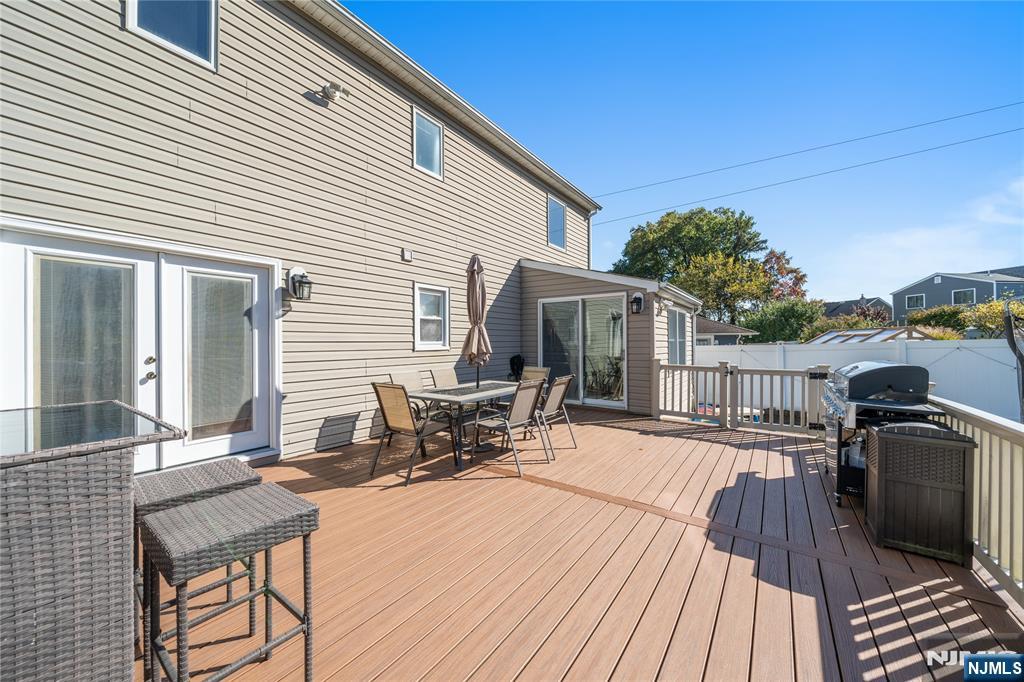 25 Glenview Road Nutley, NJ 07110 - Photo 45 of 49 a view of a patio with couches chairs and wooden floor
