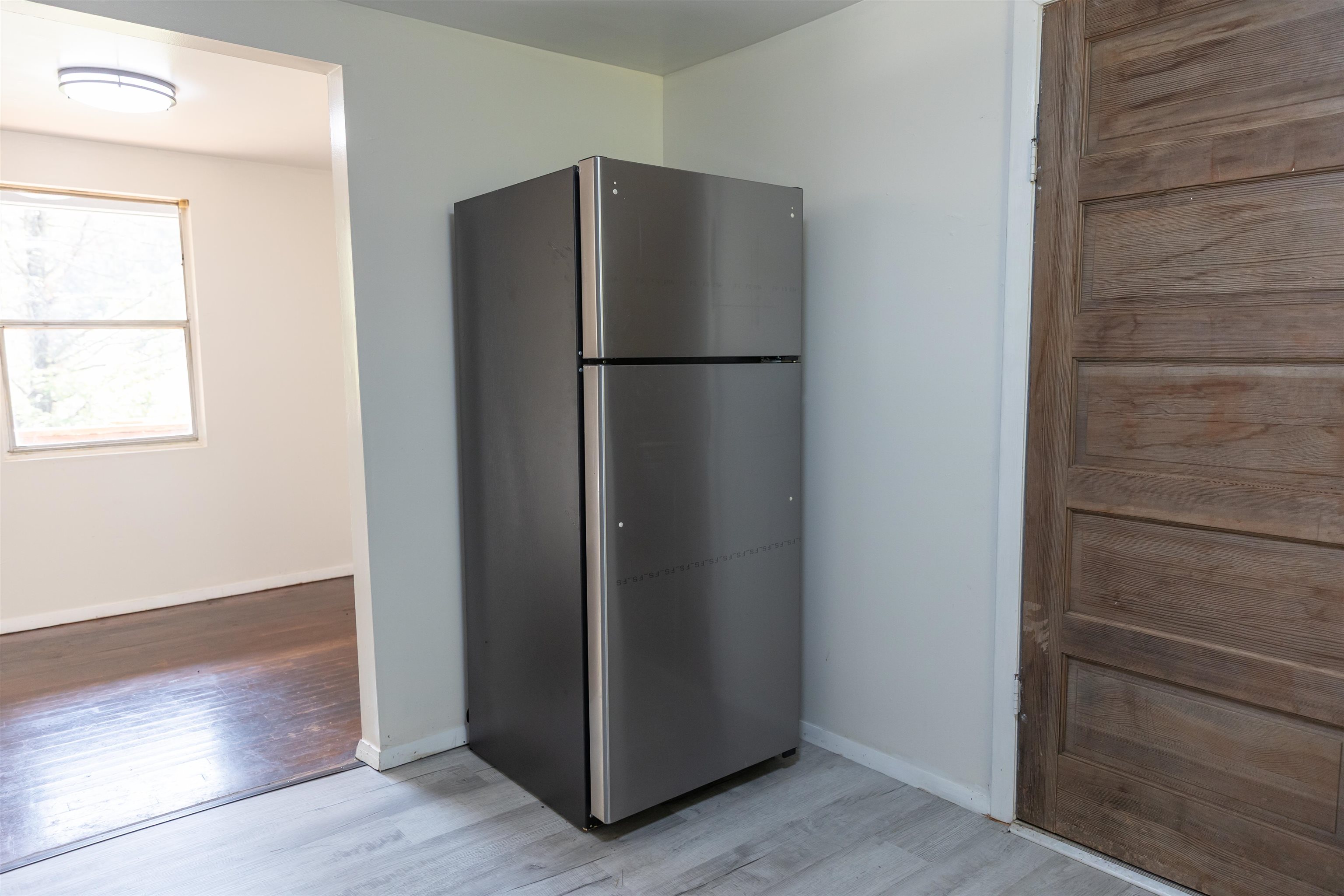 2063 Pedlar River Road Vesuvius, VA 24483 - Photo 15 of 35 an empty room with wooden floor and a window