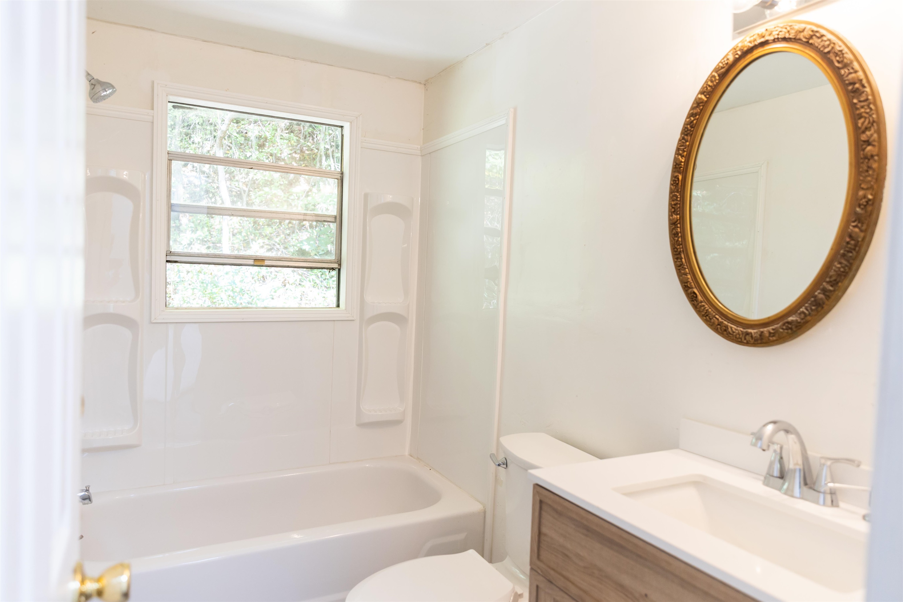 2063 Pedlar River Road Vesuvius, VA 24483 - Photo 24 of 35 a bathroom with a sink a toilet and a mirror