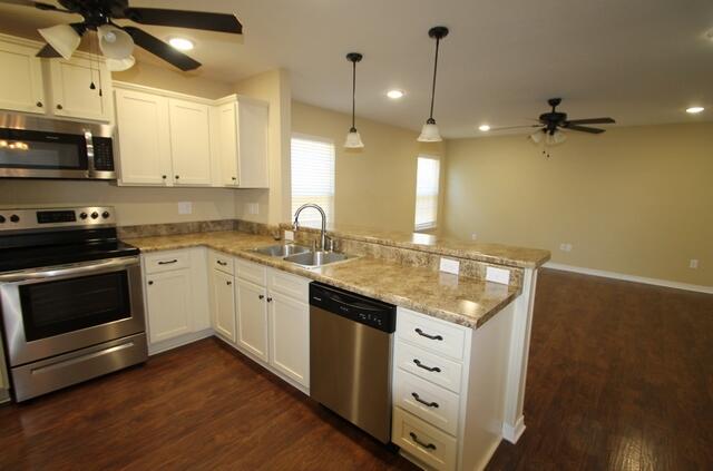 220 Wainwright Drive Crestview, FL 32539 - Photo 13 of 25 a kitchen with white cabinets and appliances