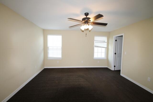 220 Wainwright Drive Crestview, FL 32539 - Photo 21 of 25 an empty room with windows and fan