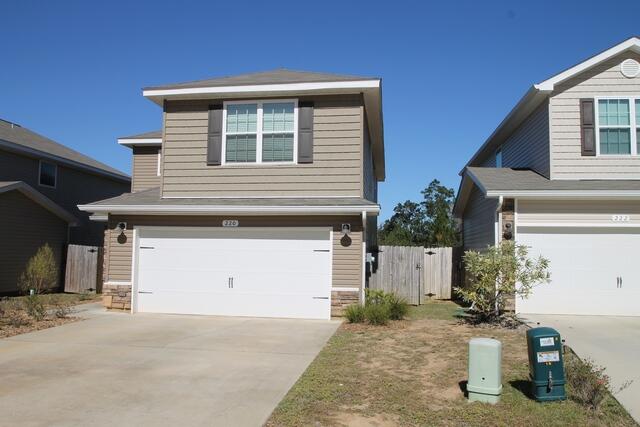 220 Wainwright Drive Crestview, FL 32539 - Photo 23 of 25 a front view of a house with a garage