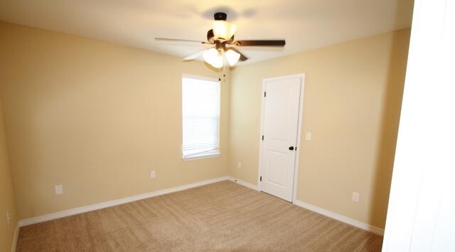 220 Wainwright Drive Crestview, FL 32539 - Photo 10 of 25 a view of a chandelier fan and fire place
