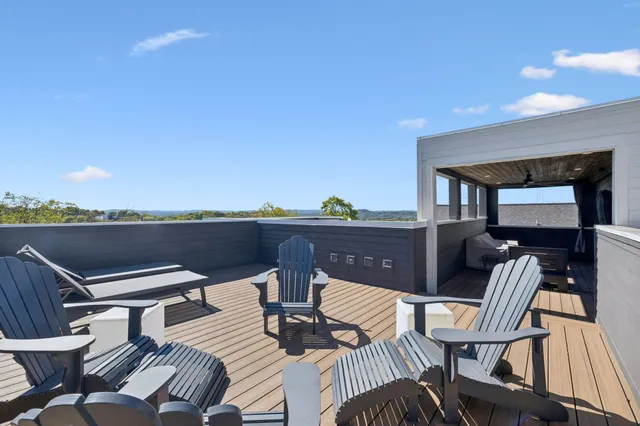 a view of a balcony with furniture