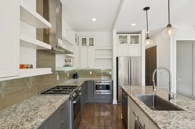 a view of deck with a table and chairs and floor to ceiling window with wooden floor