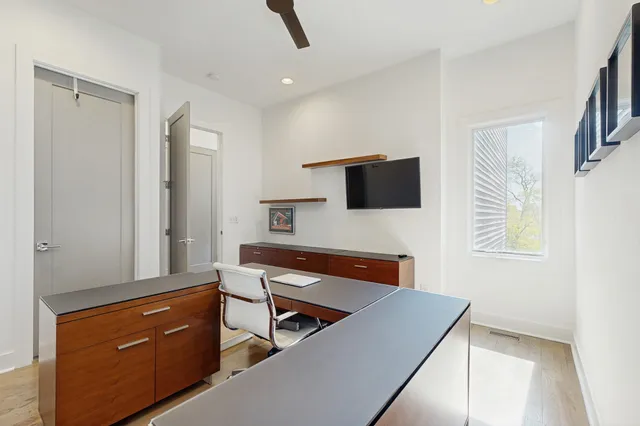 a bedroom with a bed and a night stand