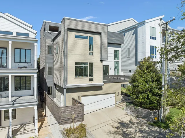 a living room with furniture a large window