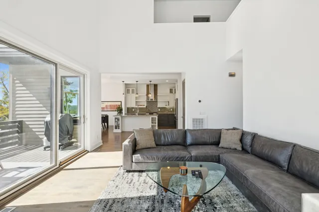 a large kitchen with kitchen island a sink stove and refrigerator