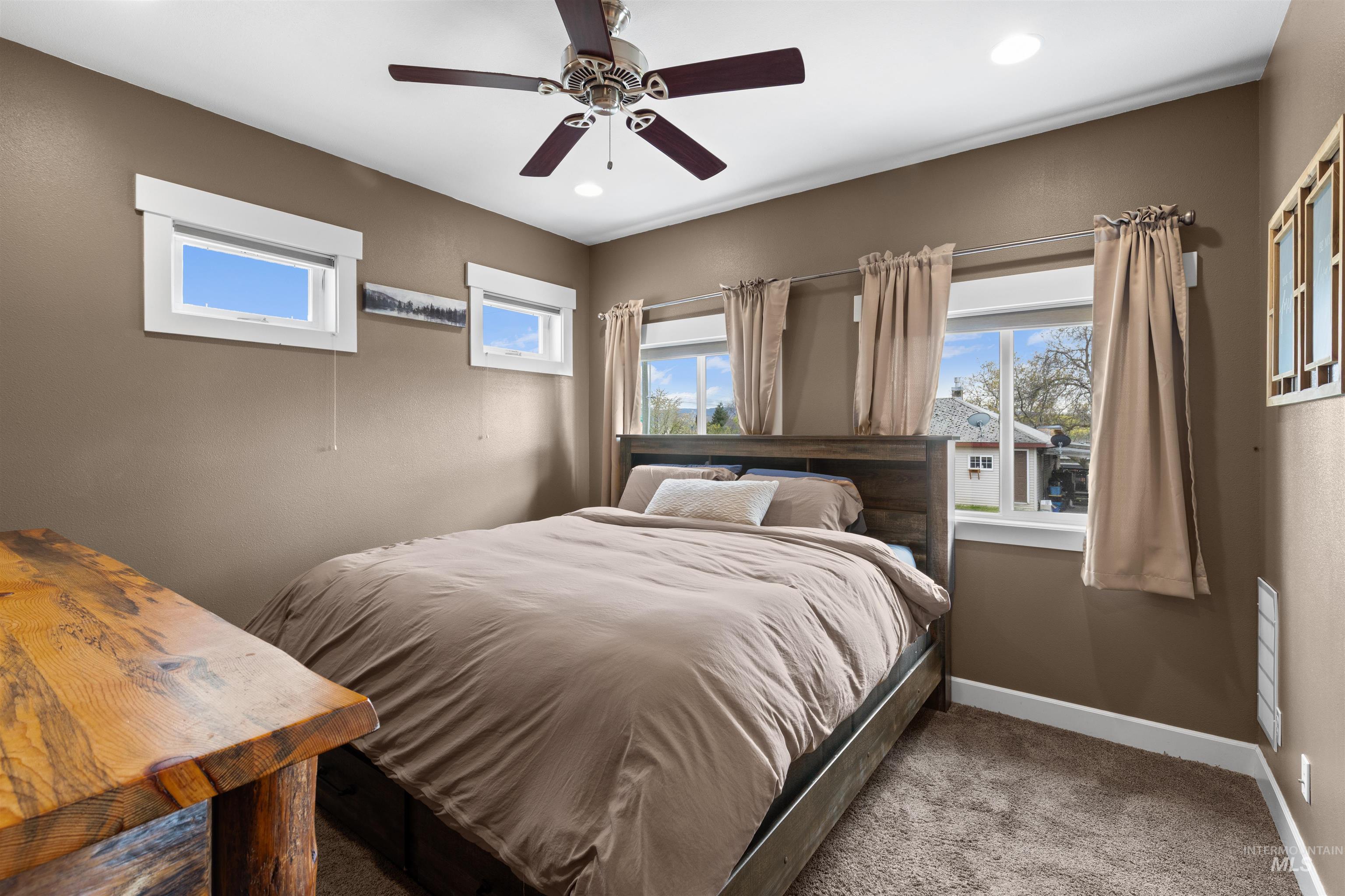 3810 21st Street Lewiston, ID 83501 - Photo 14 of 39 Bedroom with carpet floors, multiple windows, a ceiling fan, and recessed lighting