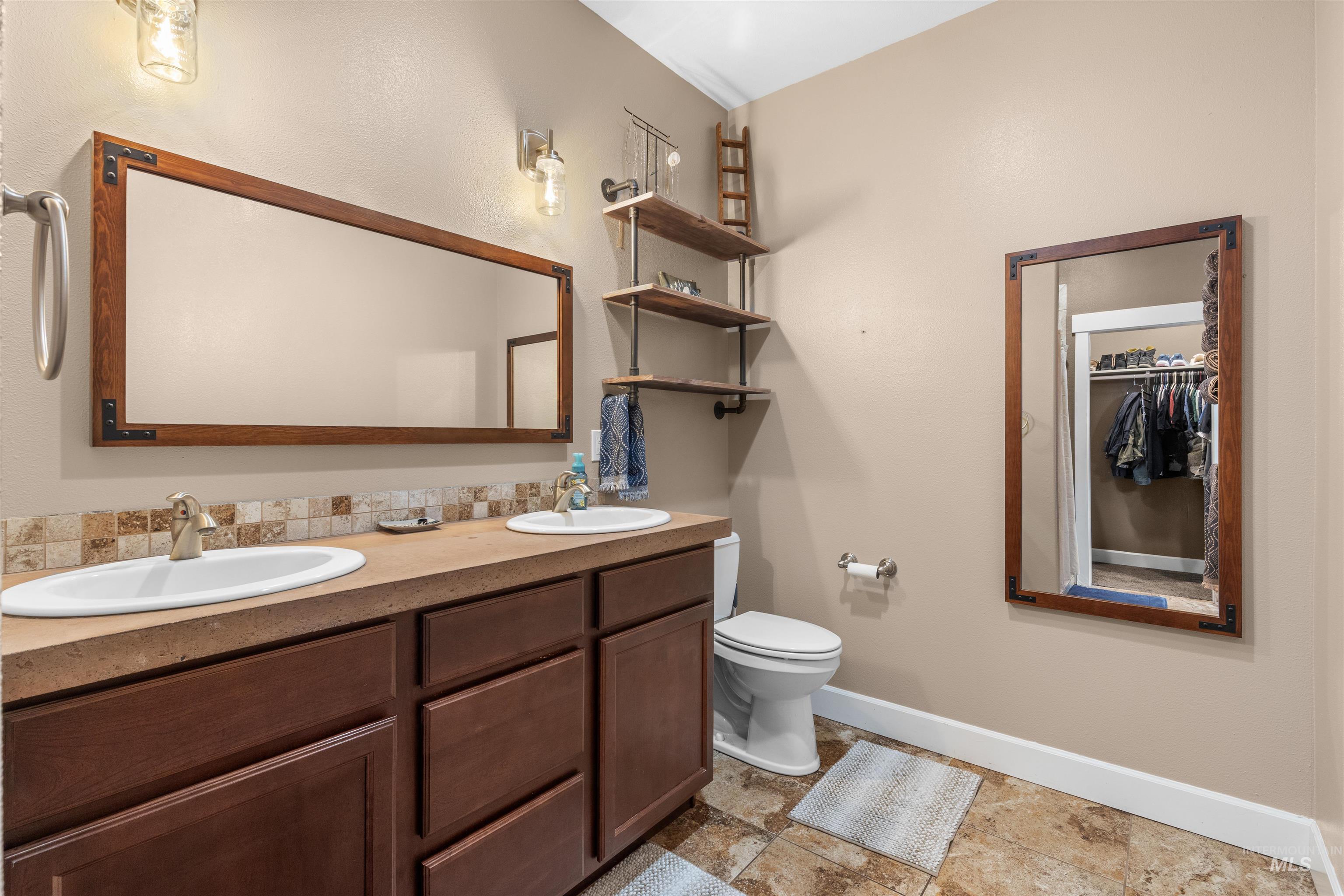 3810 21st Street Lewiston, ID 83501 - Photo 16 of 39 Bathroom with double vanity and a spacious closet