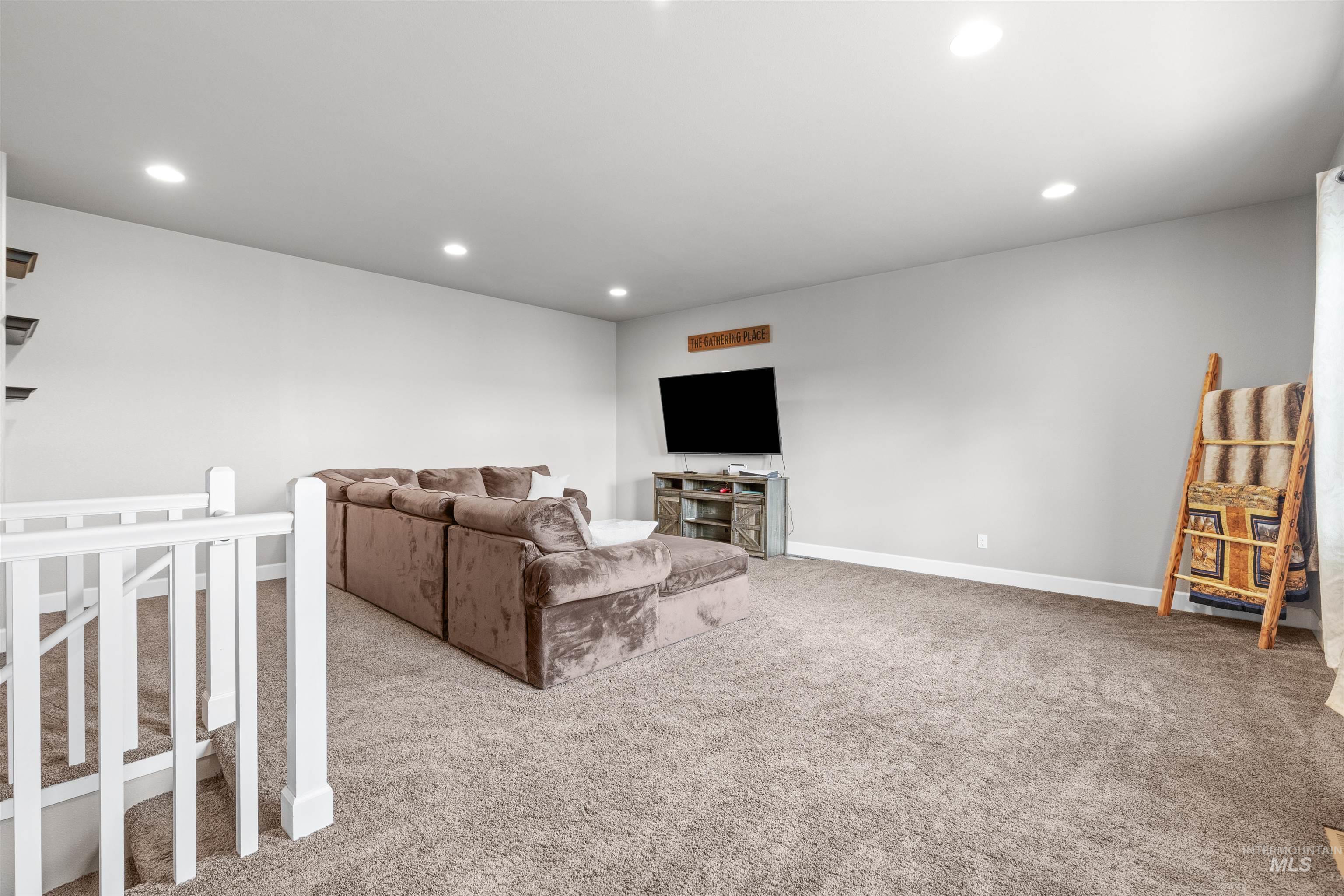 3810 21st Street Lewiston, ID 83501 - Photo 26 of 39 Living area with light carpet and recessed lighting