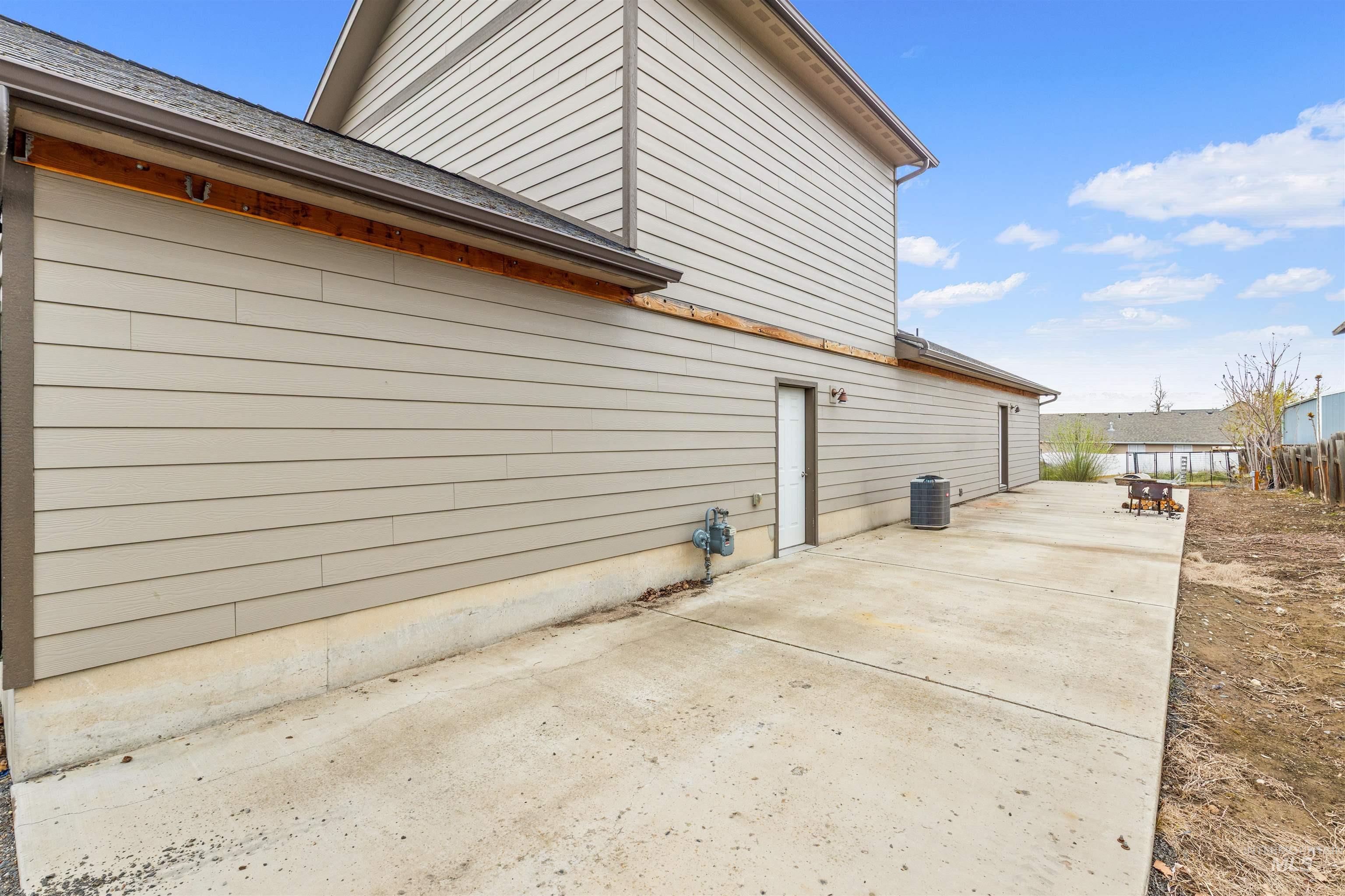 3810 21st Street Lewiston, ID 83501 - Photo 35 of 39 View of home's exterior with a patio area and a shingled roof