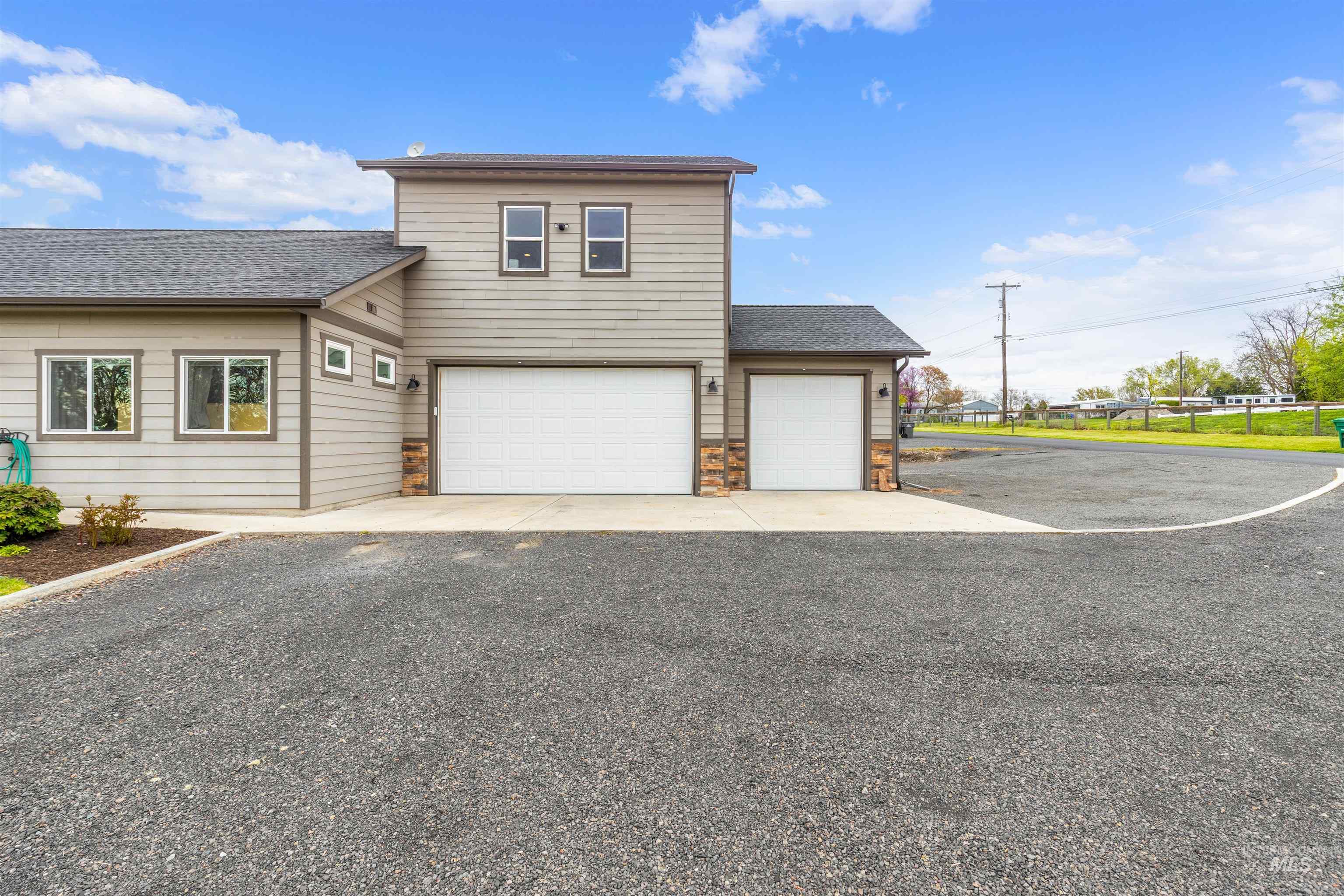 3810 21st Street Lewiston, ID 83501 - Photo 39 of 39 View of front of house with driveway, a shingled roof, a garage, and an attached garage