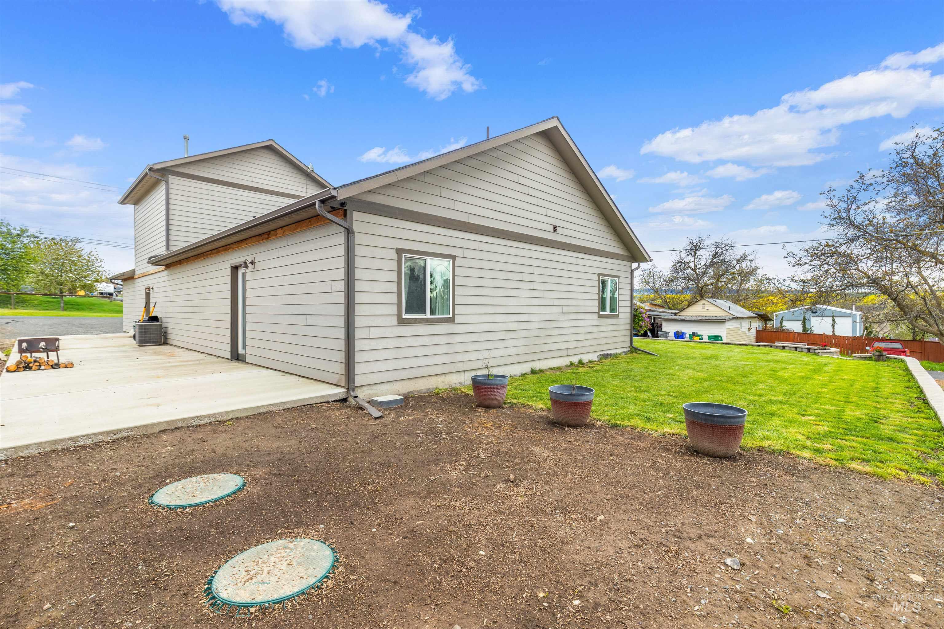 3810 21st Street Lewiston, ID 83501 - Photo 5 of 39 View of side of property with a central AC unit and a patio
