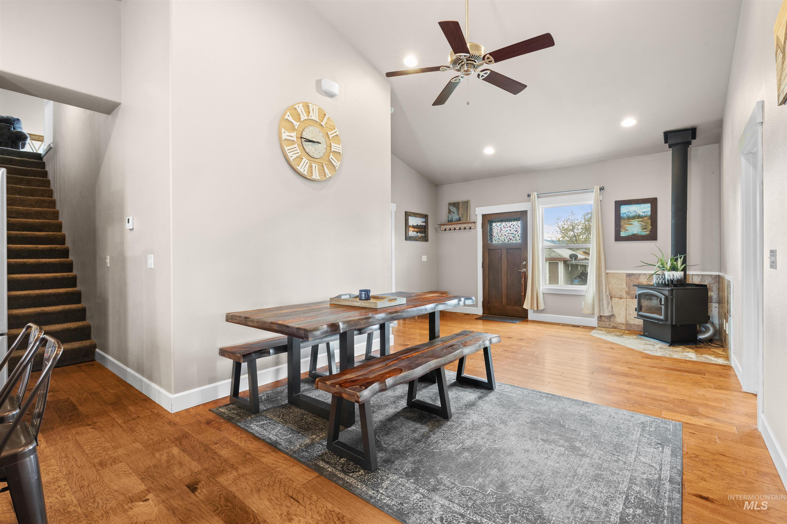 3810 21st Street Lewiston, ID 83501 - Photo 10 of 39 Dining space featuring light wood-style flooring, a wood stove, lofted ceiling, a ceiling fan, and recessed lighting