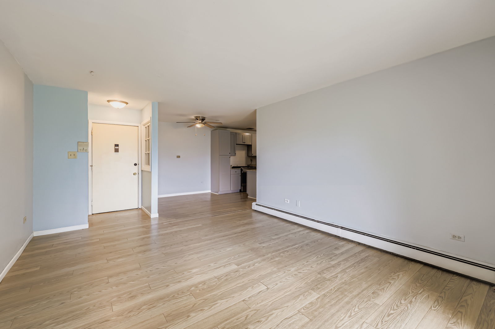 870 Winesap Court, Unit 103 Prospect Heights, IL 60070 - Photo 3 of 11 a view of an empty room and wooden floor