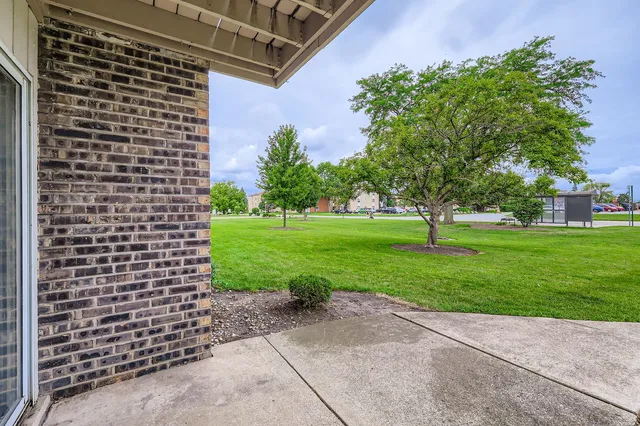 a view of a building with a yard