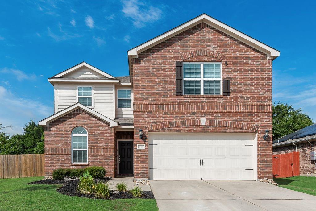 2907 Kyle Street Anna, TX 75409 - Photo 1 of 25 a front view of a house with garden