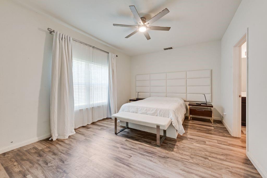 2907 Kyle Street Anna, TX 75409 - Photo 11 of 25 a bedroom with a bed and a window