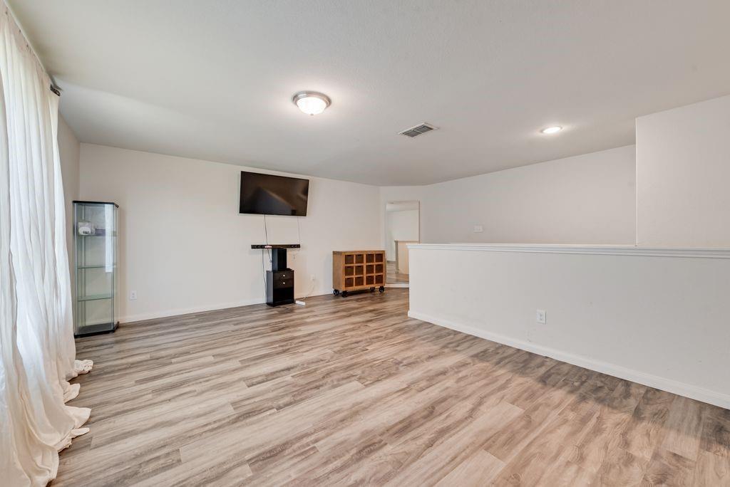 2907 Kyle Street Anna, TX 75409 - Photo 14 of 25 a view of empty room with wooden floor