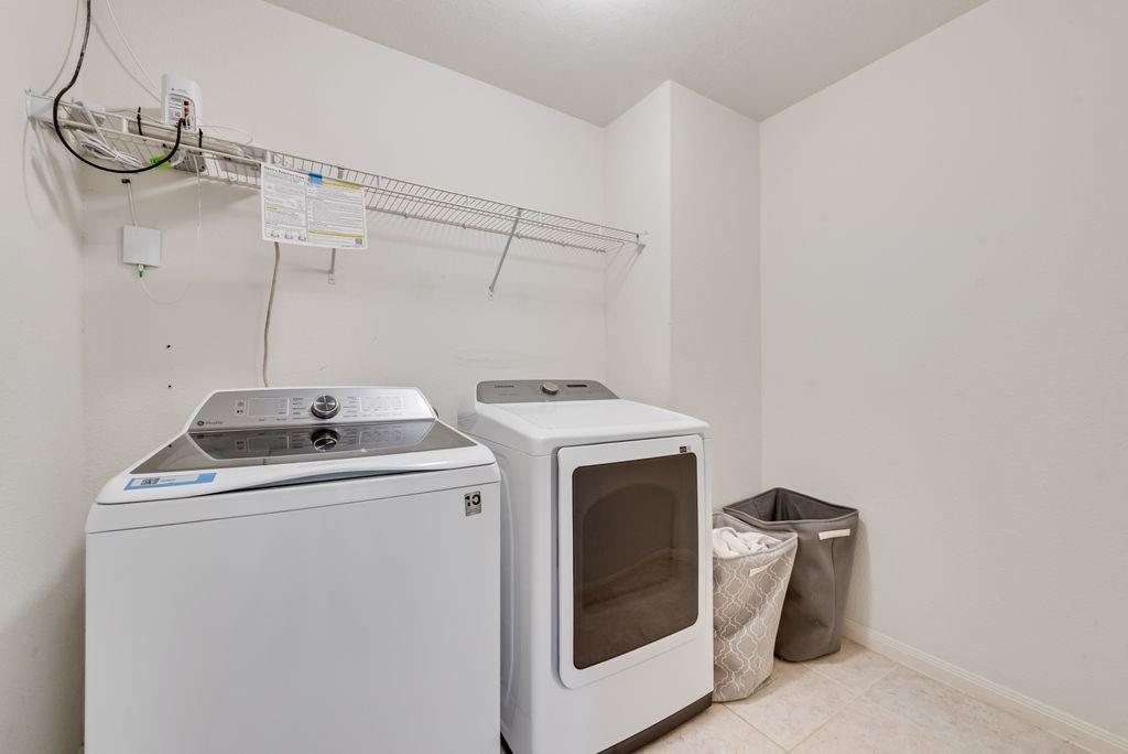2907 Kyle Street Anna, TX 75409 - Photo 15 of 25 a utility room with dryer and washer