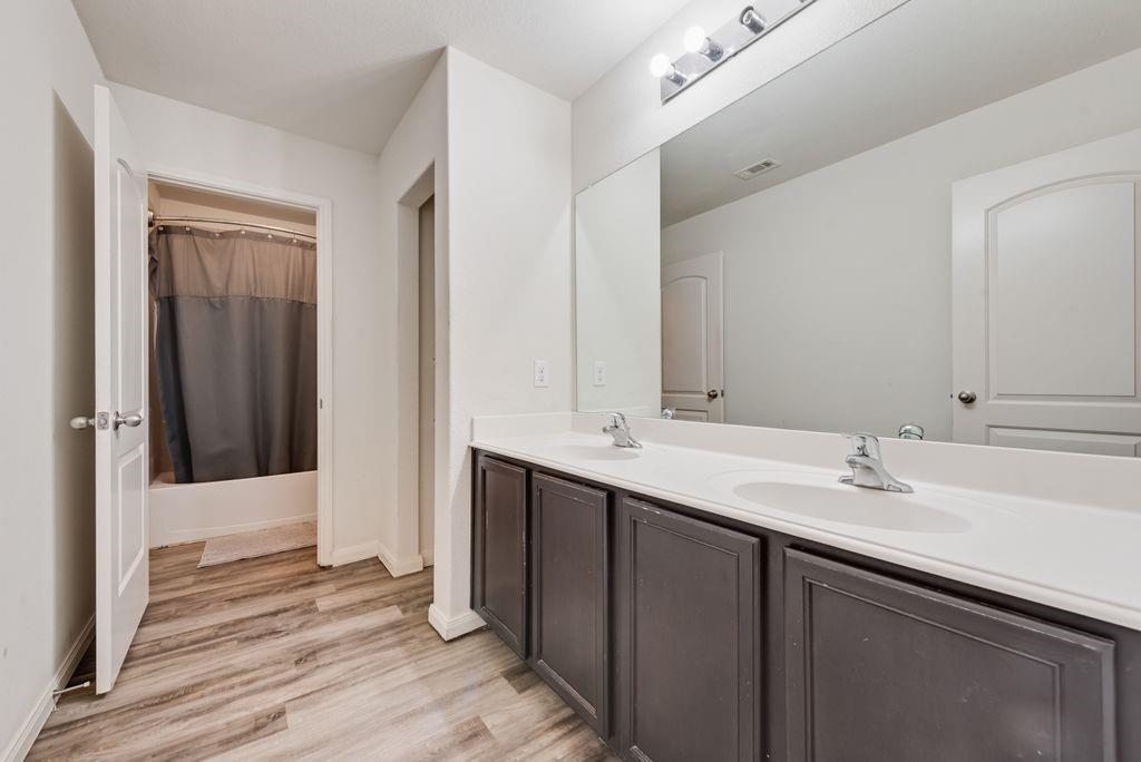 2907 Kyle Street Anna, TX 75409 - Photo 20 of 25 a bathroom with a sink and a mirror