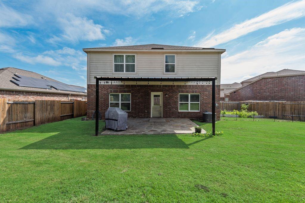 2907 Kyle Street Anna, TX 75409 - Photo 22 of 25 a view of a house with a yard and a large tree