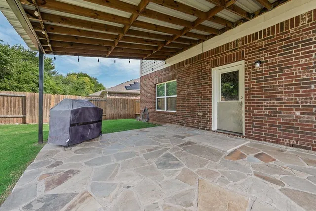 a backyard of a house with seating space