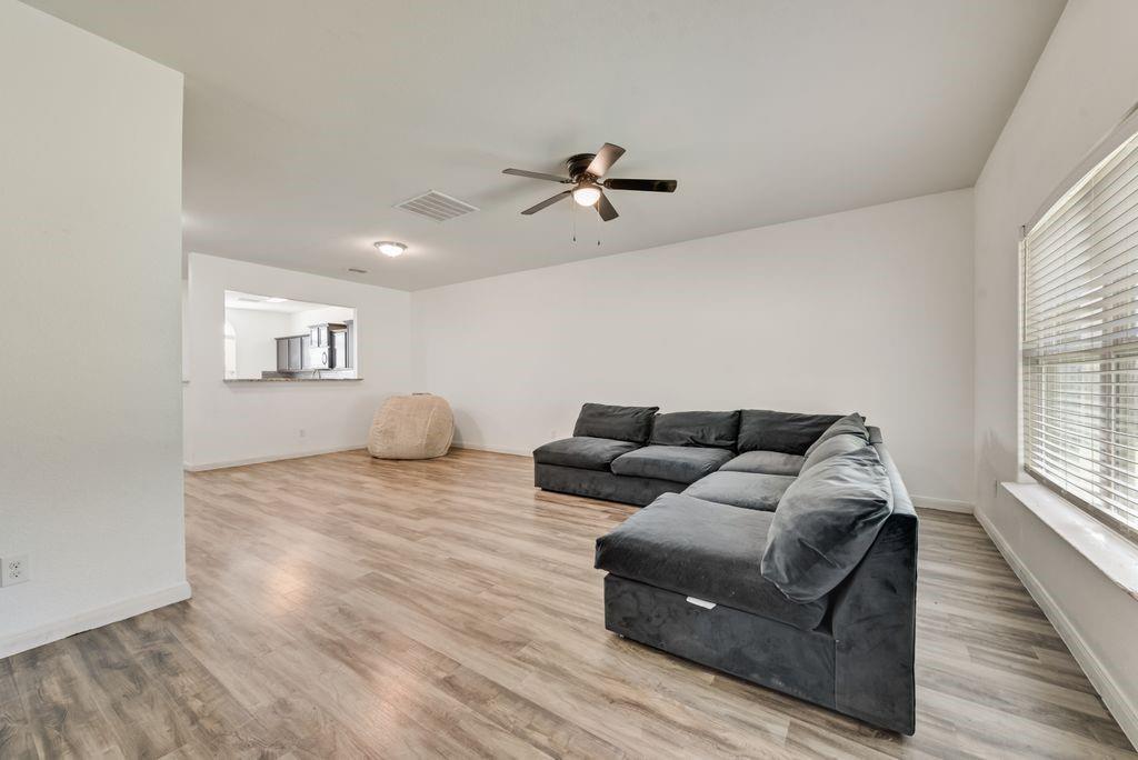 2907 Kyle Street Anna, TX 75409 - Photo 3 of 25 a living room with furniture and a window