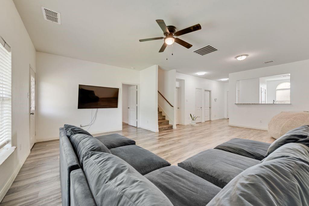 2907 Kyle Street Anna, TX 75409 - Photo 4 of 25 a living room with furniture and a flat screen tv with wooden floor