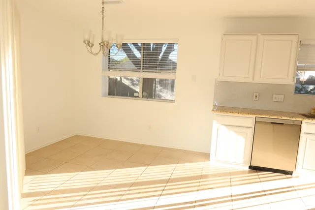 a kitchen with a sink cabinets and appliances