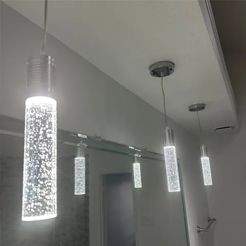 a bathroom with a tub shower and sink