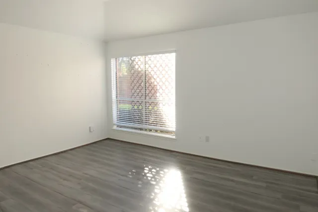 a bathroom with a tub sink and a mirror