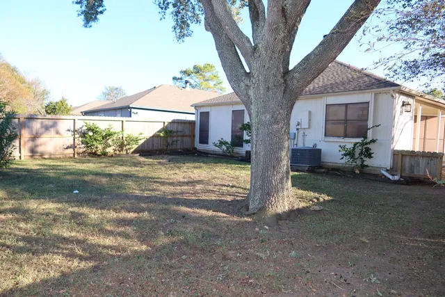 a view of backyard with outdoor seating