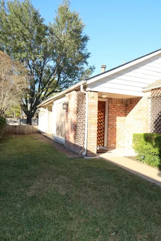 a view of a big yard with an outdoor space