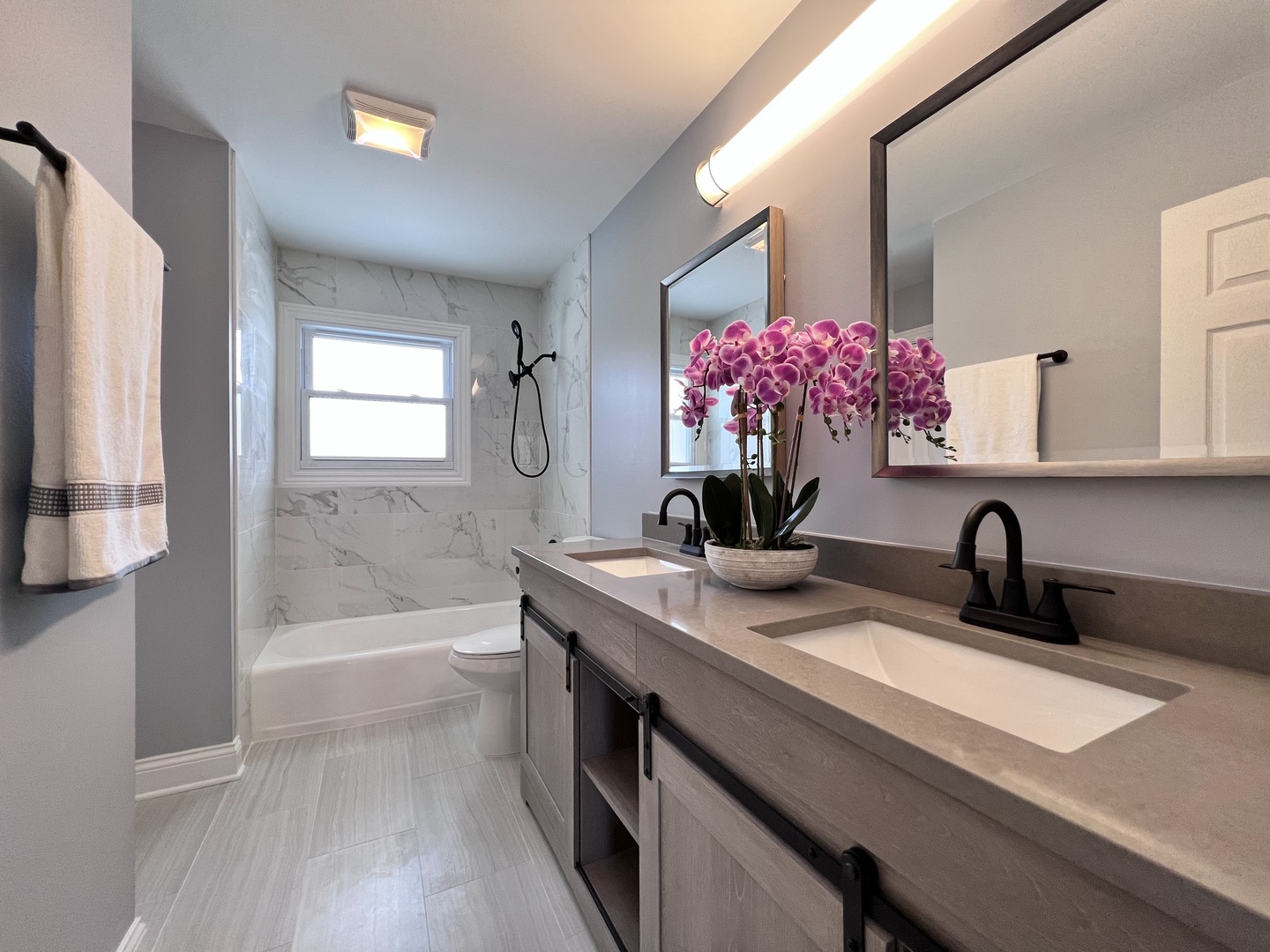 235 North Rohlwing Road Palatine, IL 60074 - Photo 18 of 35 a bathroom with a sink a vanity and a mirror