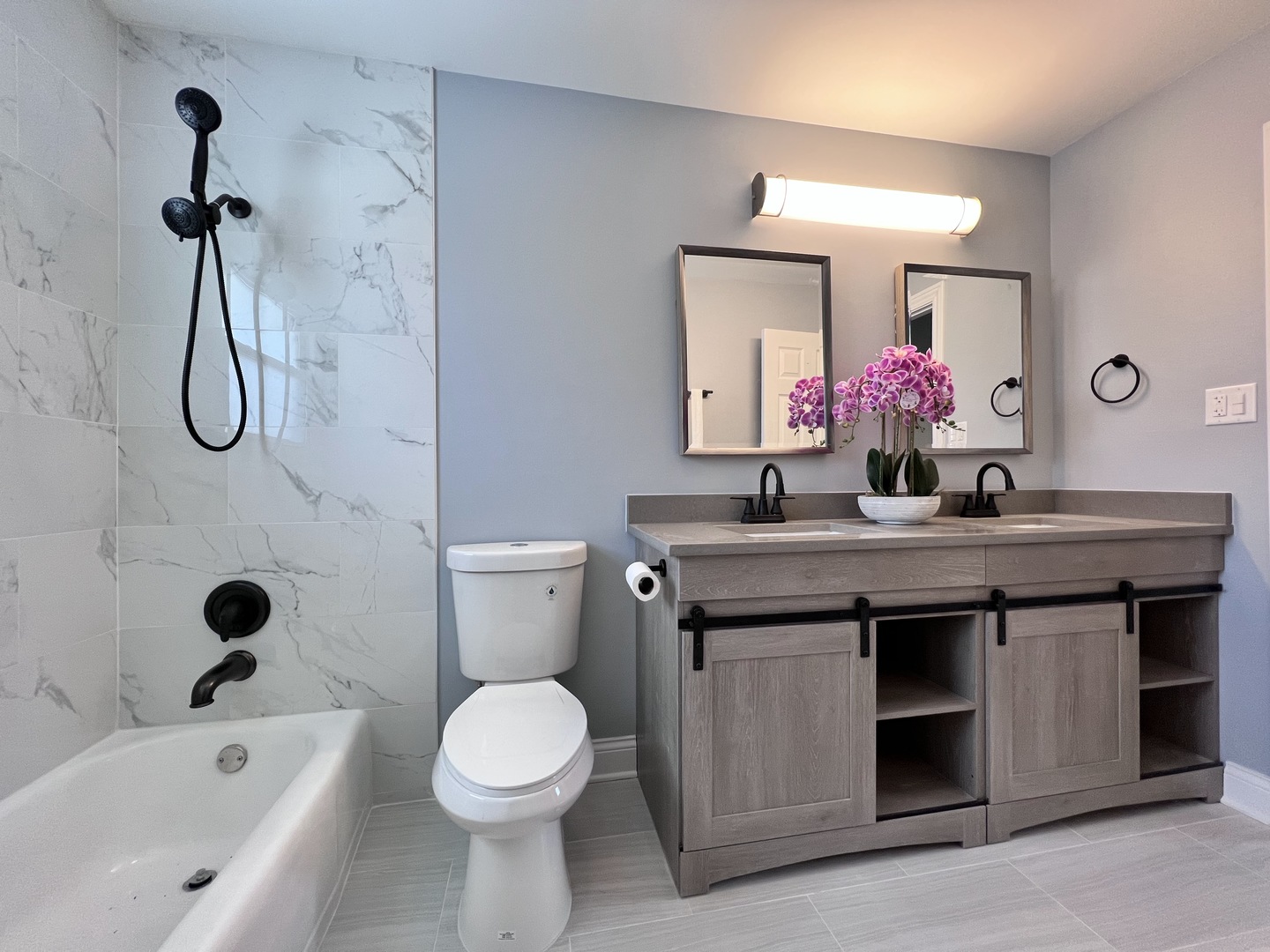 235 North Rohlwing Road Palatine, IL 60074 - Photo 19 of 35 a bathroom with a granite countertop sink a toilet and shower