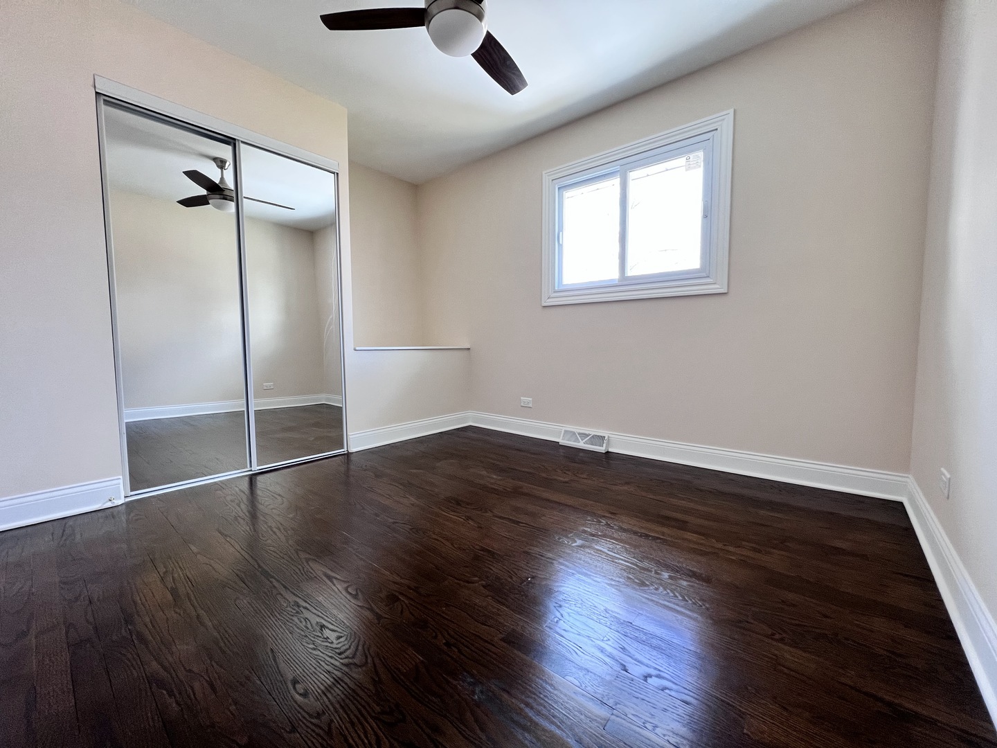 235 North Rohlwing Road Palatine, IL 60074 - Photo 20 of 35 an empty room with wooden floor and windows