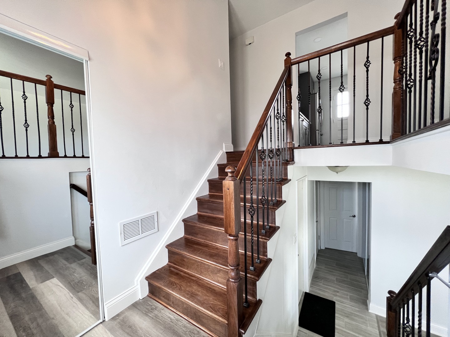 235 North Rohlwing Road Palatine, IL 60074 - Photo 2 of 35 a view of staircase with lots of frames on wall and a window