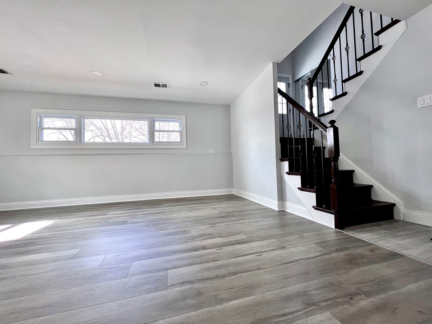 235 North Rohlwing Road Palatine, IL 60074 - Photo 24 of 35 a view of entryway and hall with wooden floor
