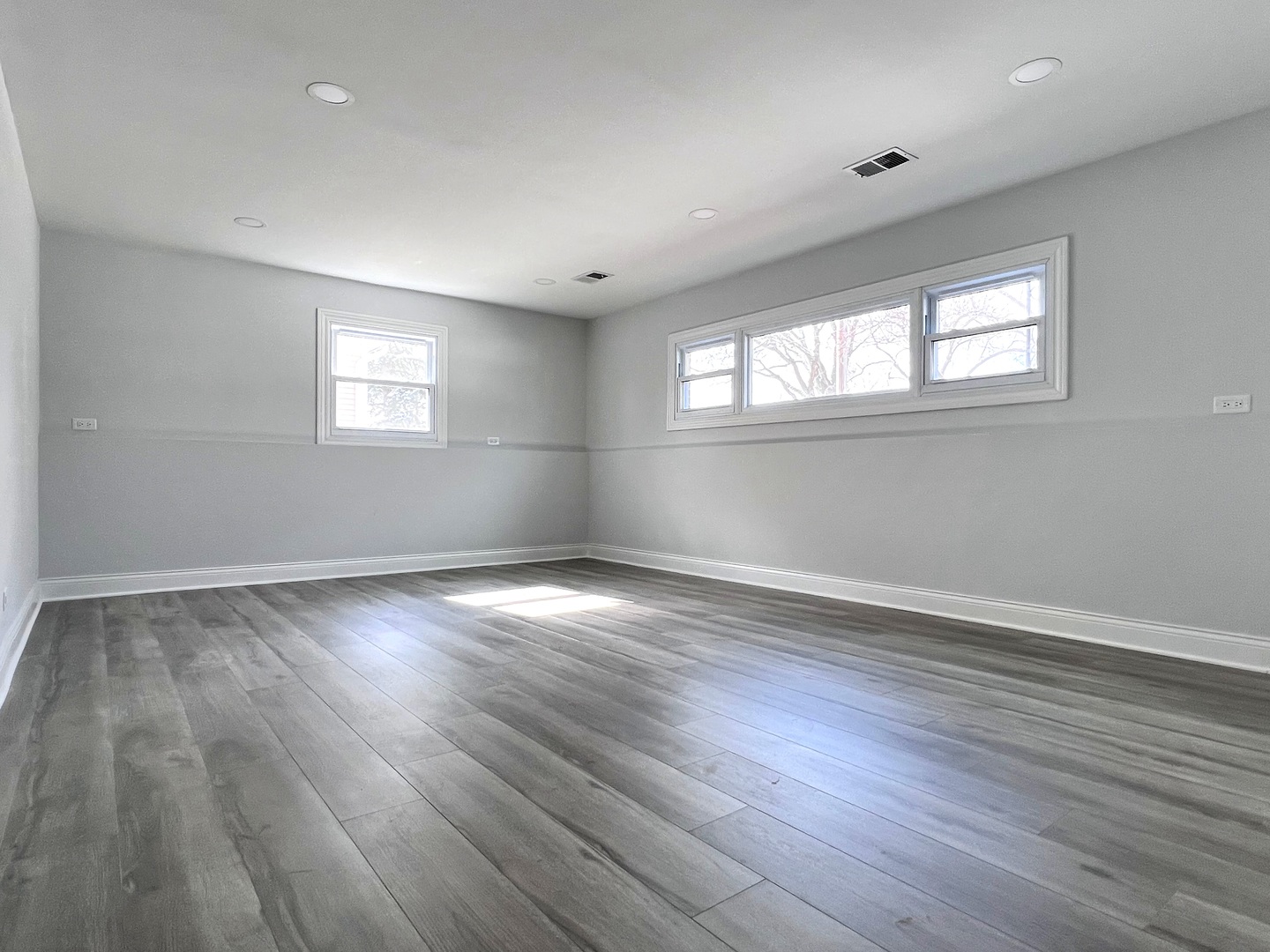 235 North Rohlwing Road Palatine, IL 60074 - Photo 25 of 35 an empty room with wooden floor and windows