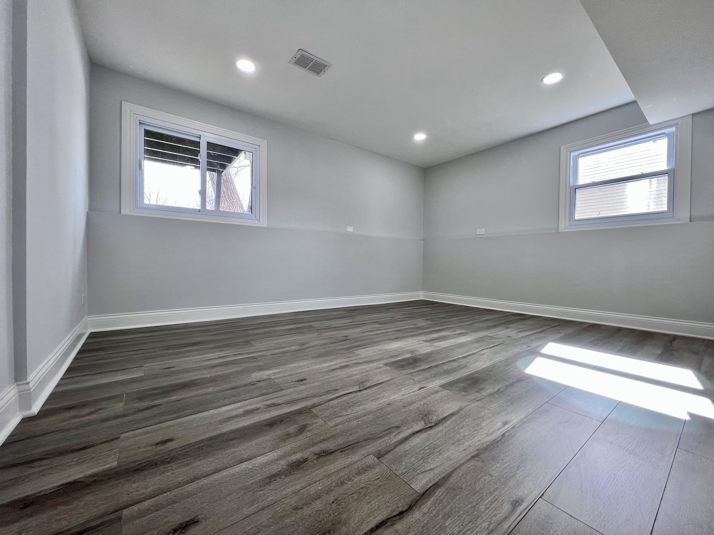 235 North Rohlwing Road Palatine, IL 60074 - Photo 26 of 35 a view of empty room with wooden floor and fan