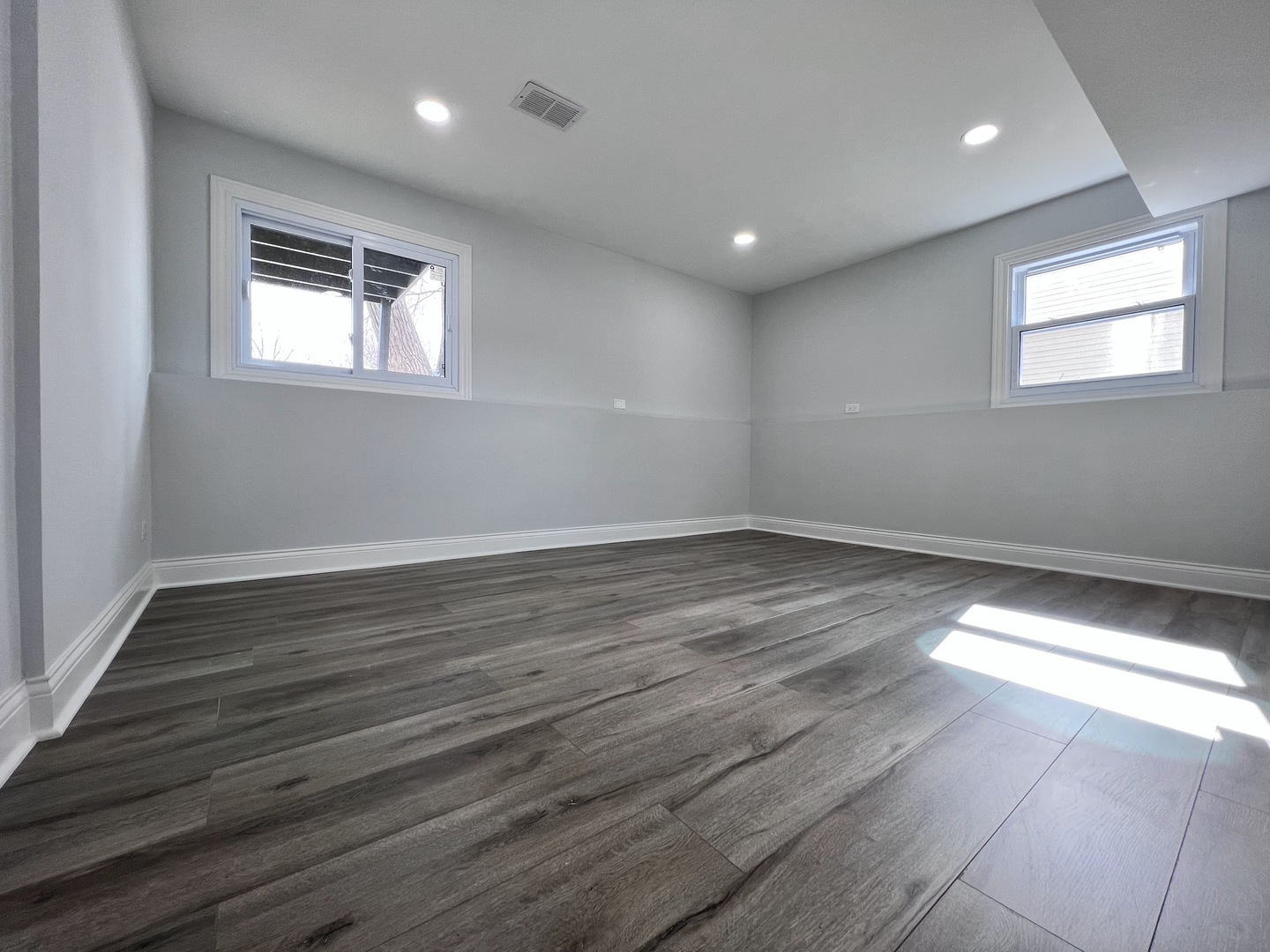 235 North Rohlwing Road Palatine, IL 60074 - Photo 27 of 35 a view of empty room with wooden floor and fan