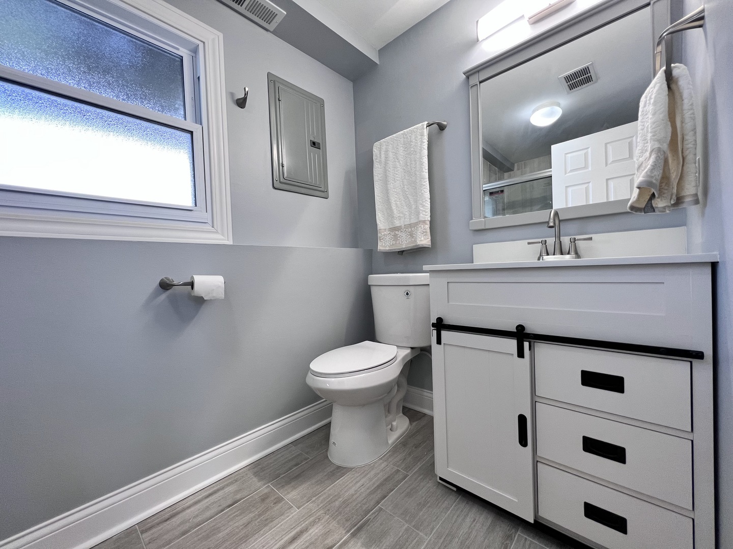 235 North Rohlwing Road Palatine, IL 60074 - Photo 28 of 35 a bathroom with a sink a toilet and mirror