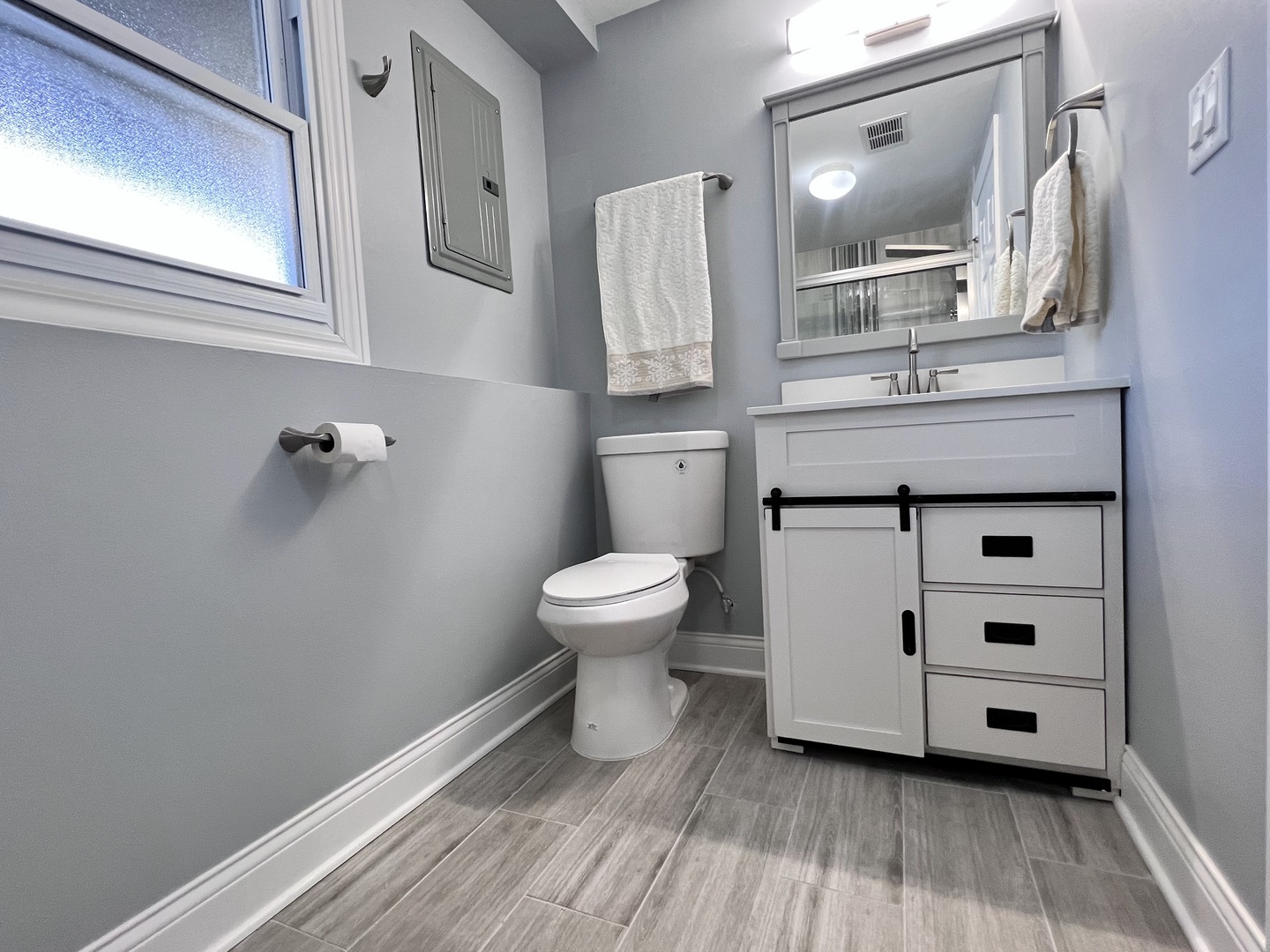 235 North Rohlwing Road Palatine, IL 60074 - Photo 30 of 35 a bathroom with a sink mirror and toilet