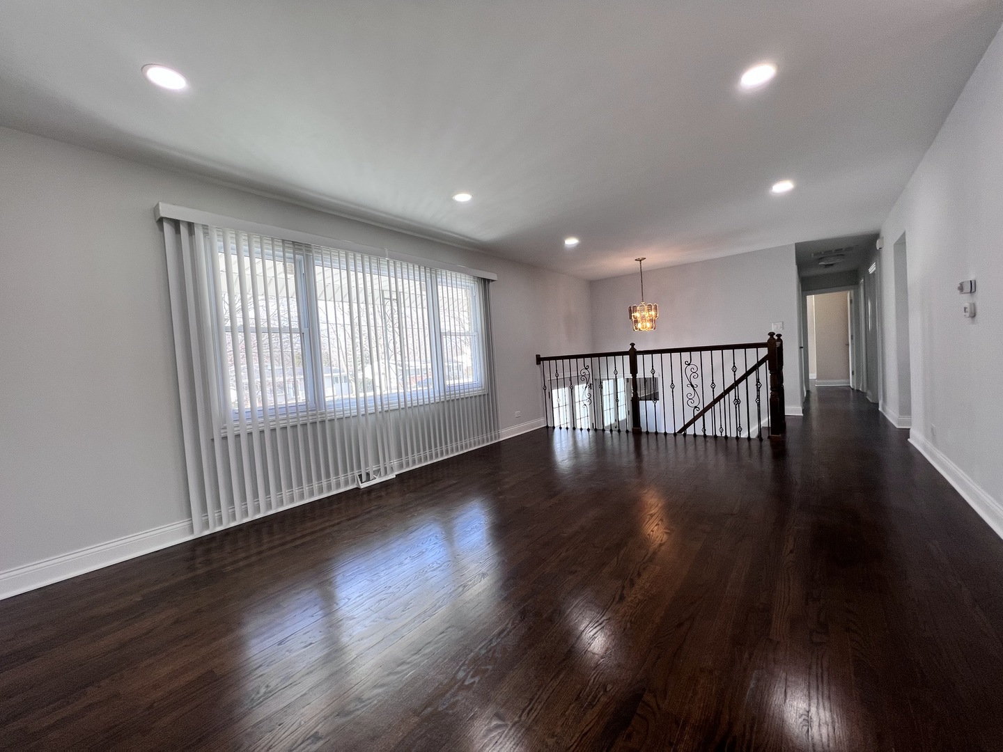 235 North Rohlwing Road Palatine, IL 60074 - Photo 4 of 35 an empty room with wooden floor and windows