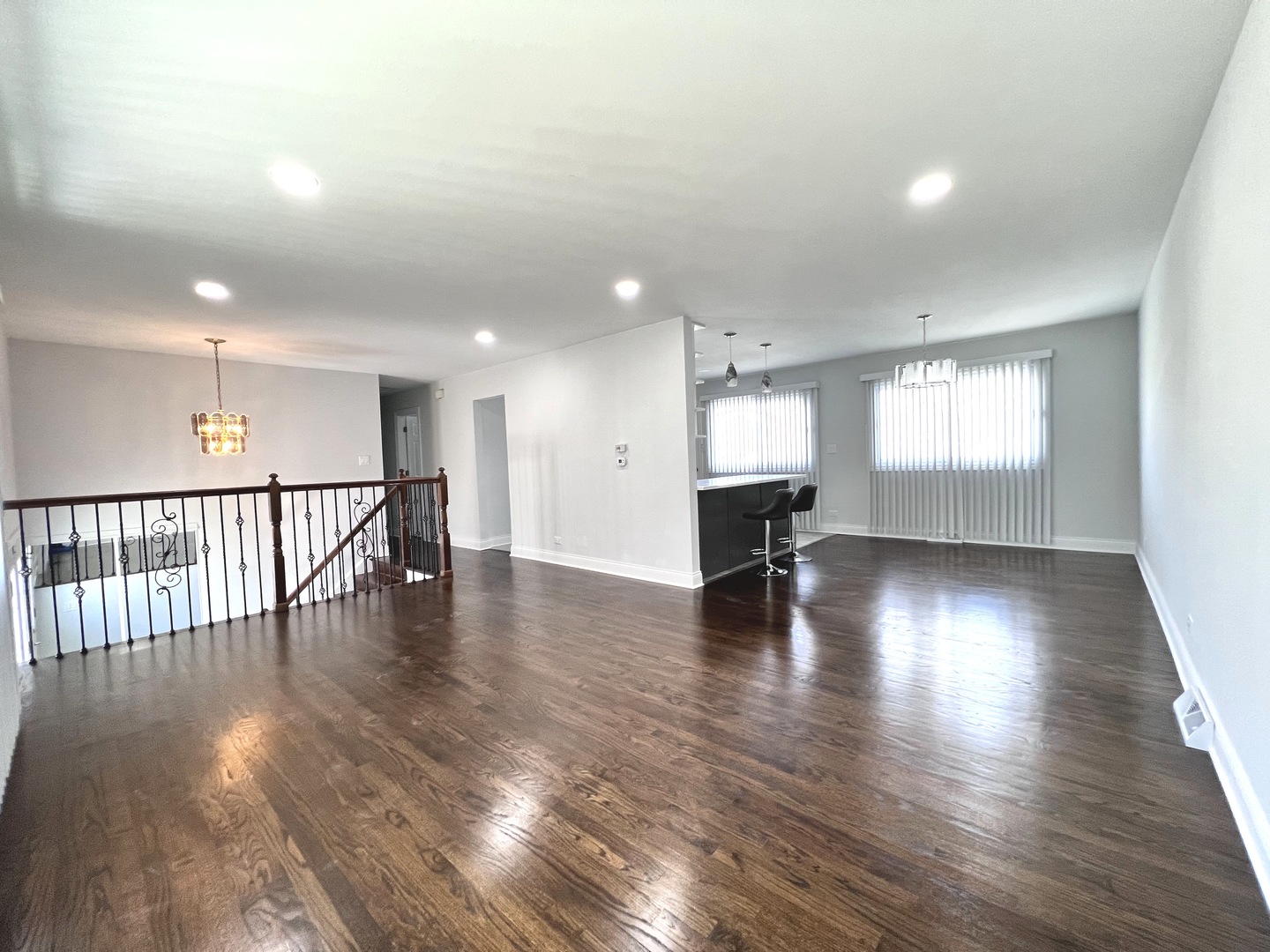 235 North Rohlwing Road Palatine, IL 60074 - Photo 7 of 35 a view of empty room with wooden floor and windows